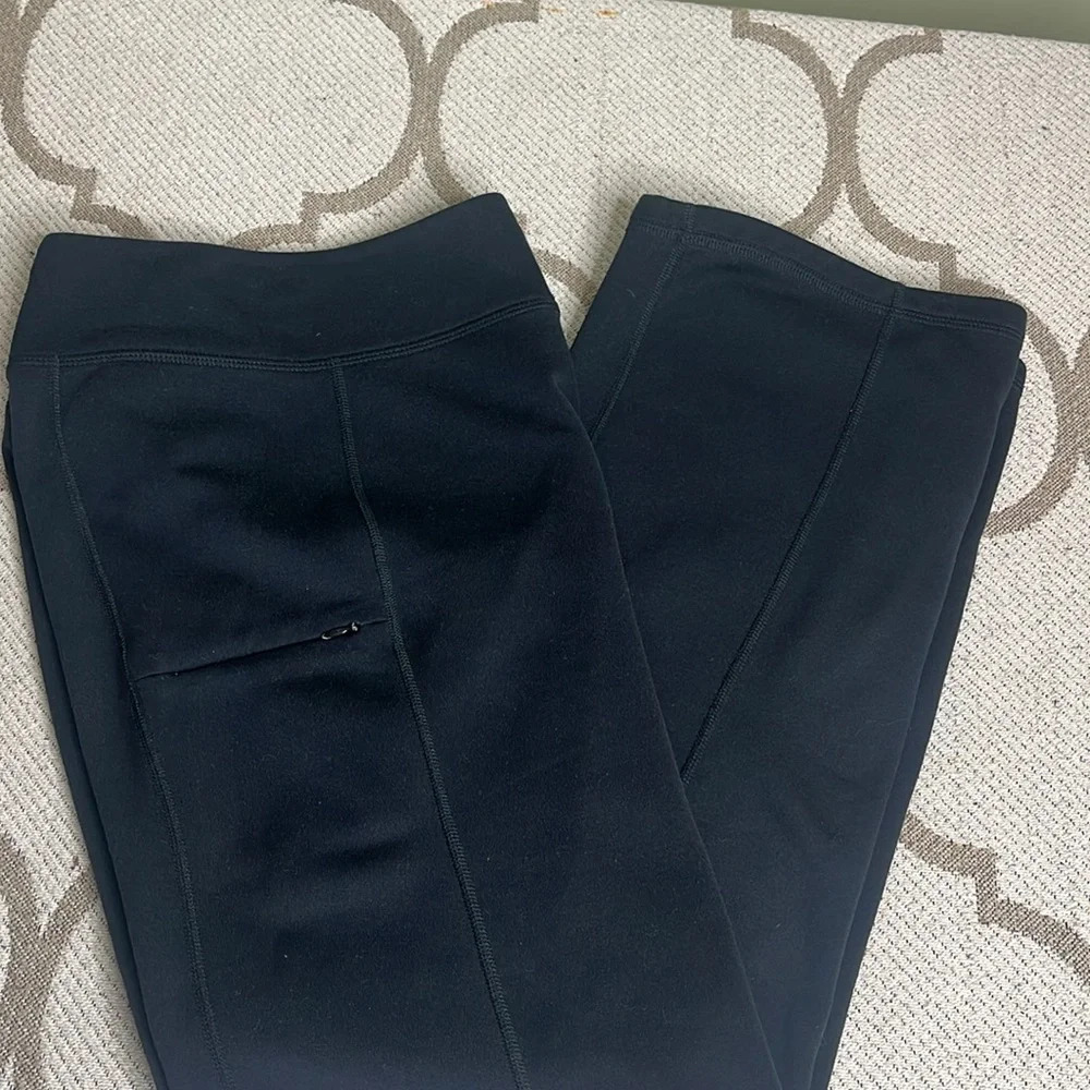 Mountain Hardwear Performance fleece lined bootcut pull on zip pocket pants